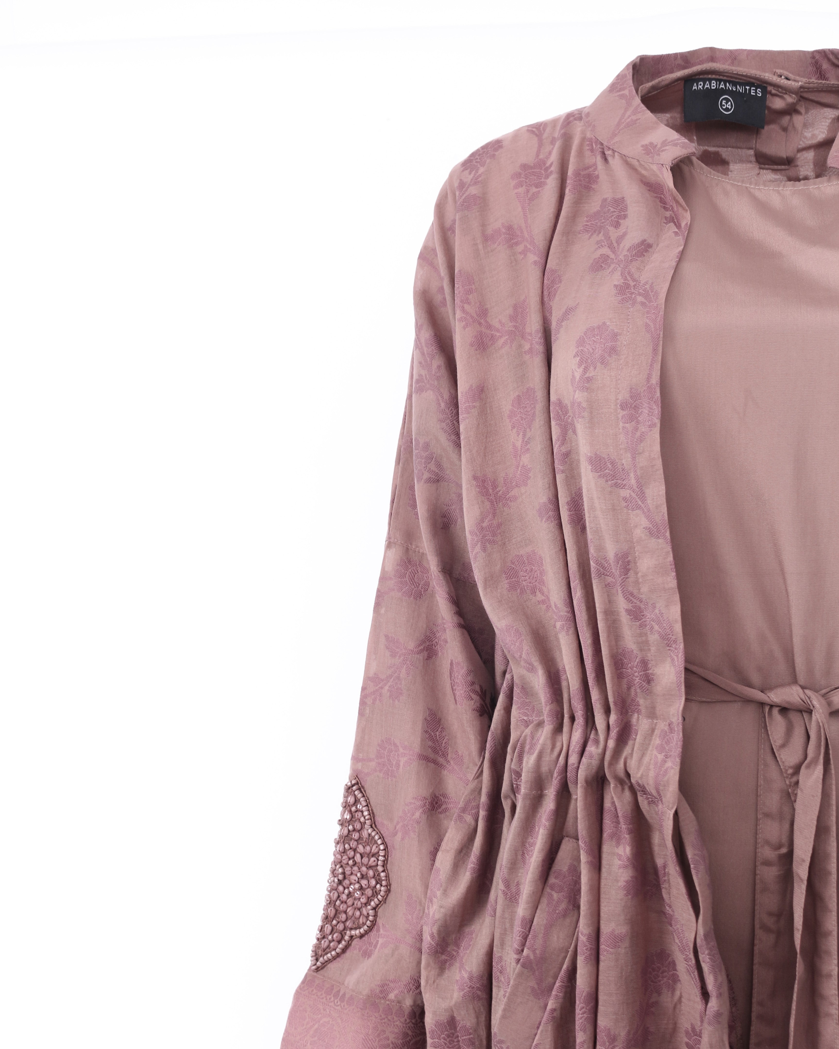 Back view of DUSK Clay jacket with embroidered hem detail