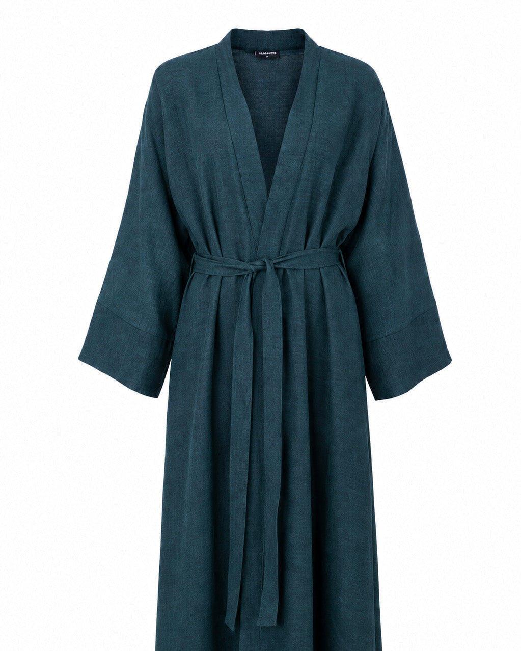 Model wearing the Fayrouz teal linen jacket over the matching Fayrouz abaya