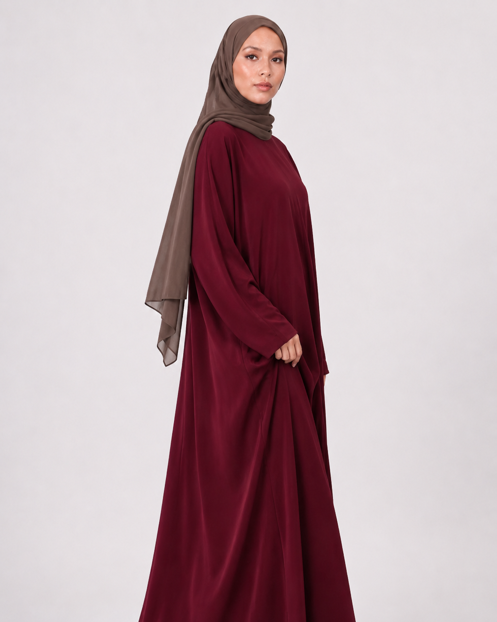 Full length maroon everyday abaya with loose flowing fit and wide sleeves