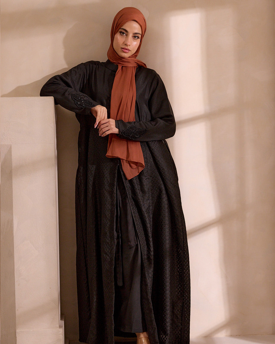 Hand-applied beading detail on the front of the black Keffiyeh jacket