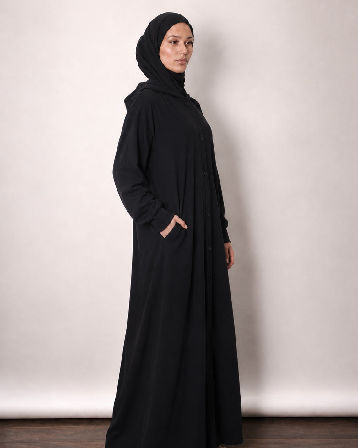 Hooded jersey jacket shown open over an everyday abaya