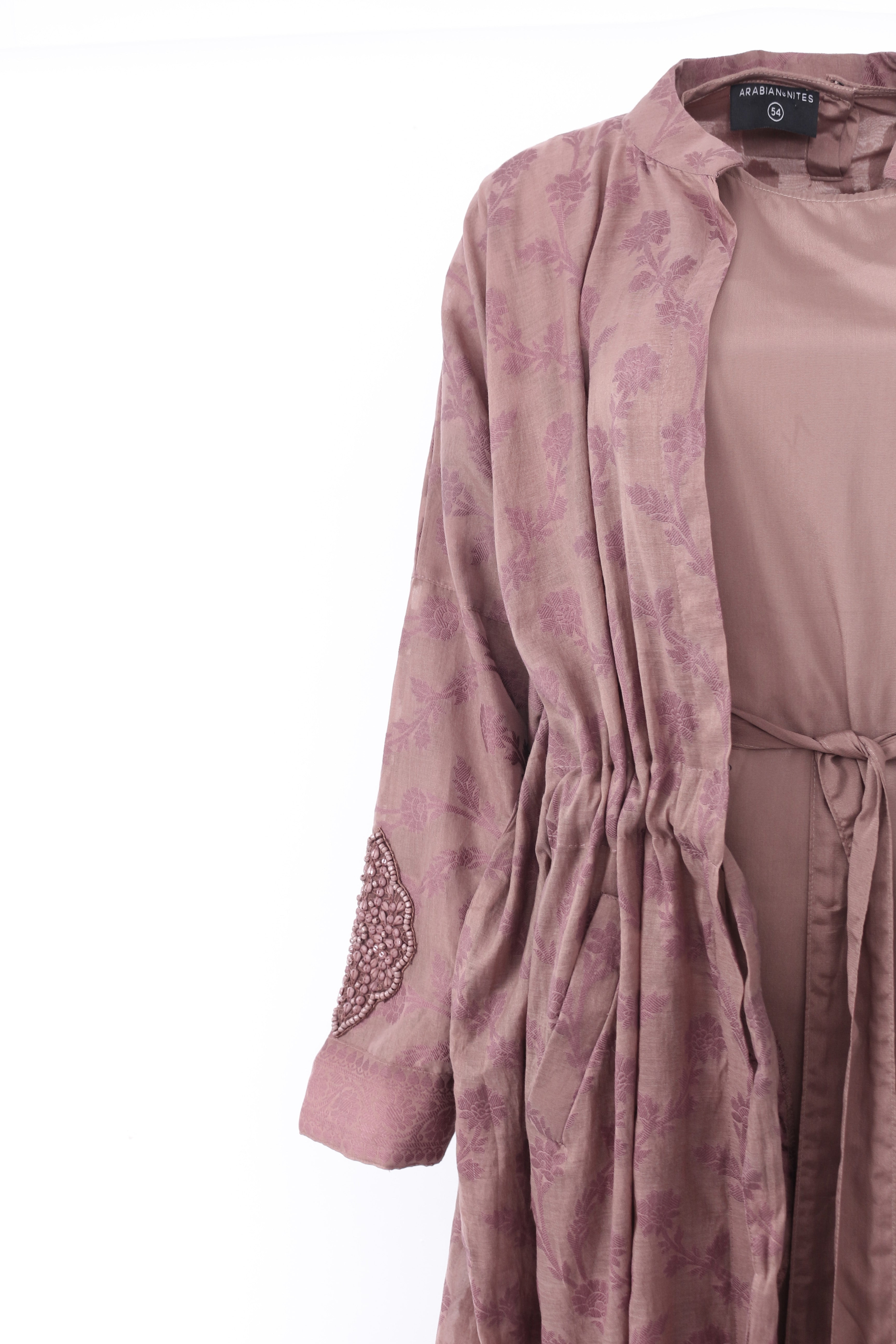 Back view of DUSK Clay jacket with embroidered hem detail
