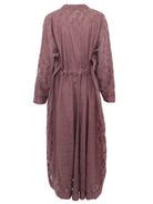 Clay mauve jacket set styled as a modest wedding guest outfit