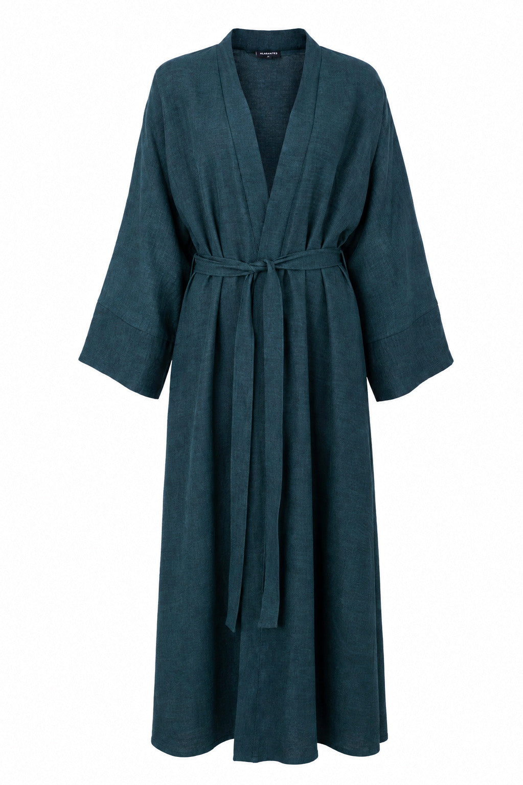 Model wearing the Fayrouz teal linen jacket over the matching Fayrouz abaya