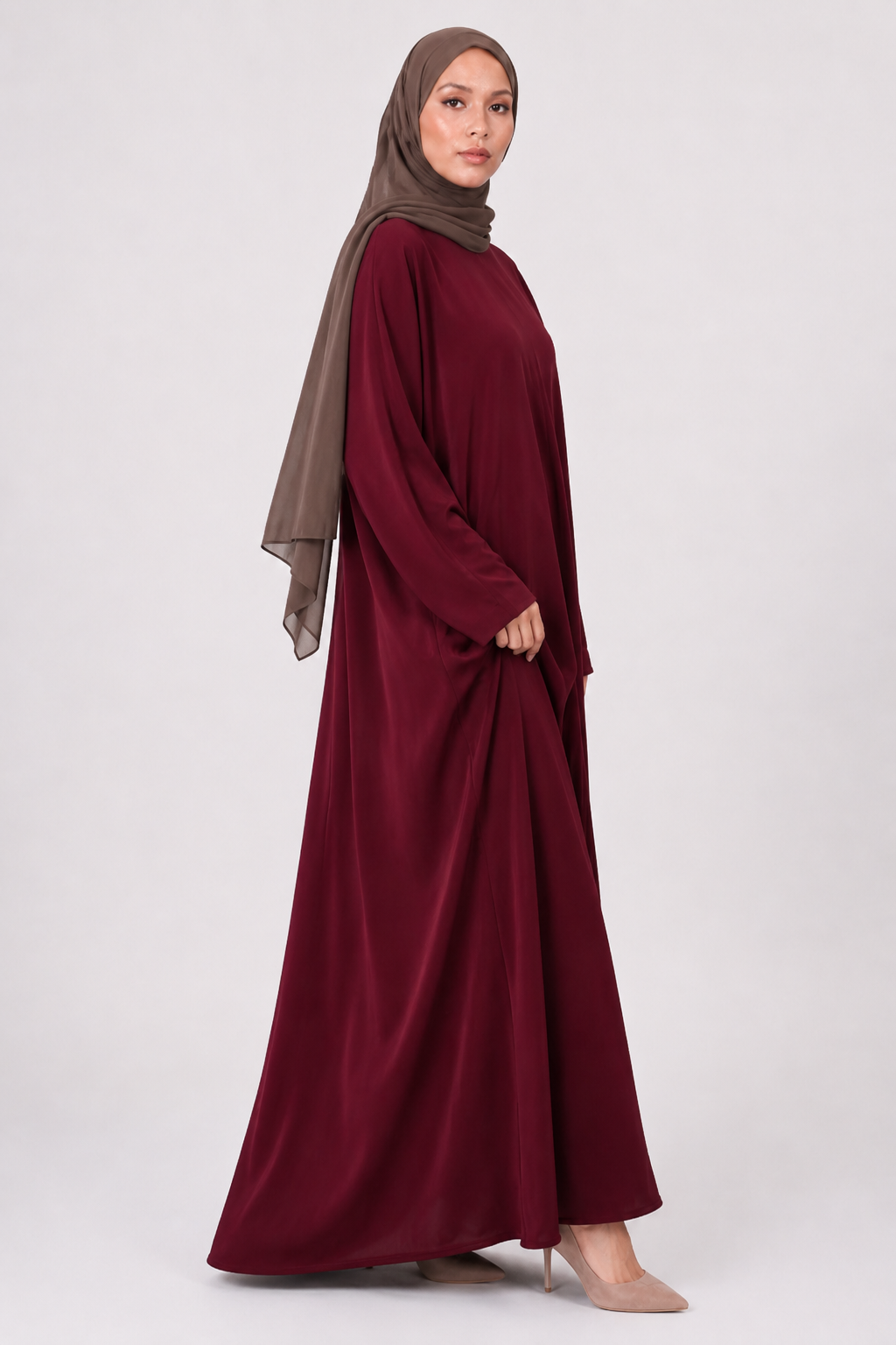 Full length maroon everyday abaya with loose flowing fit and wide sleeves
