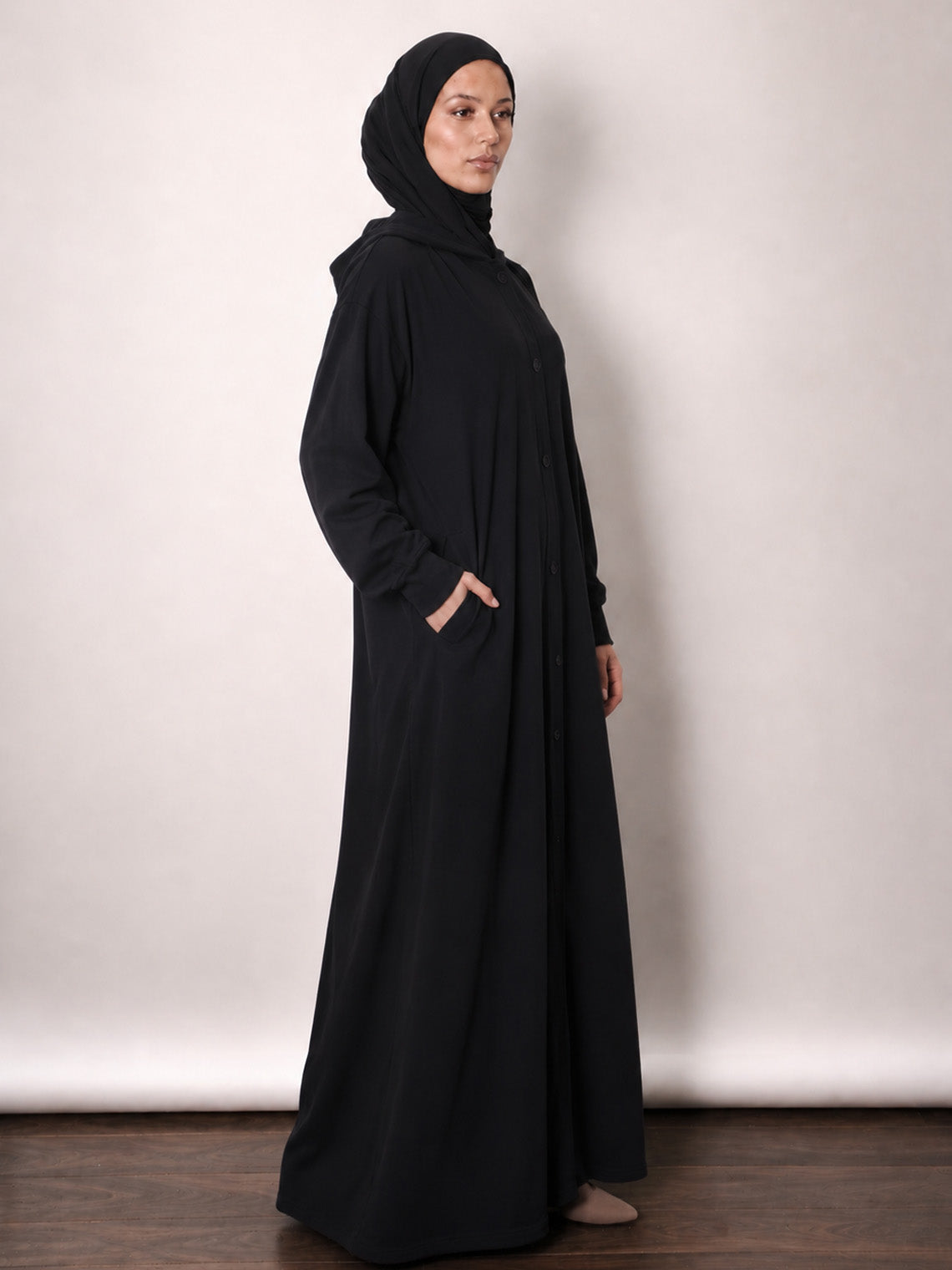 Hooded jersey jacket shown open over an everyday abaya