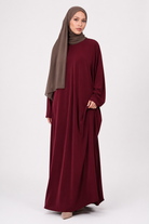Pomegranate maroon Madina everyday kaftan front view with brown chiffon hijab
