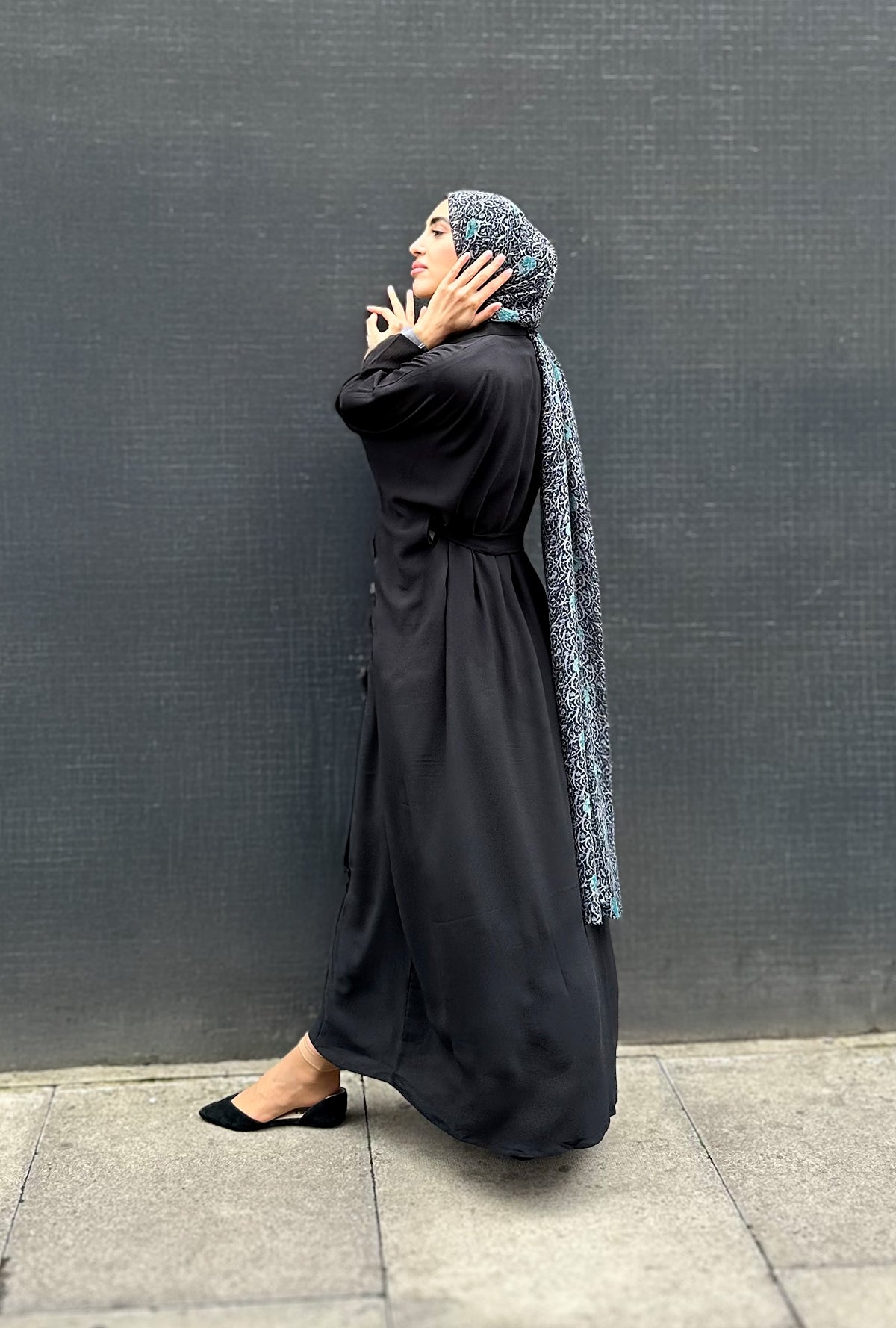 Woman in a long black Kaftan and headscarf  or hijab 
