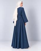 Side view of the Bahr blue linen jacket showing the flared sweep at the hem