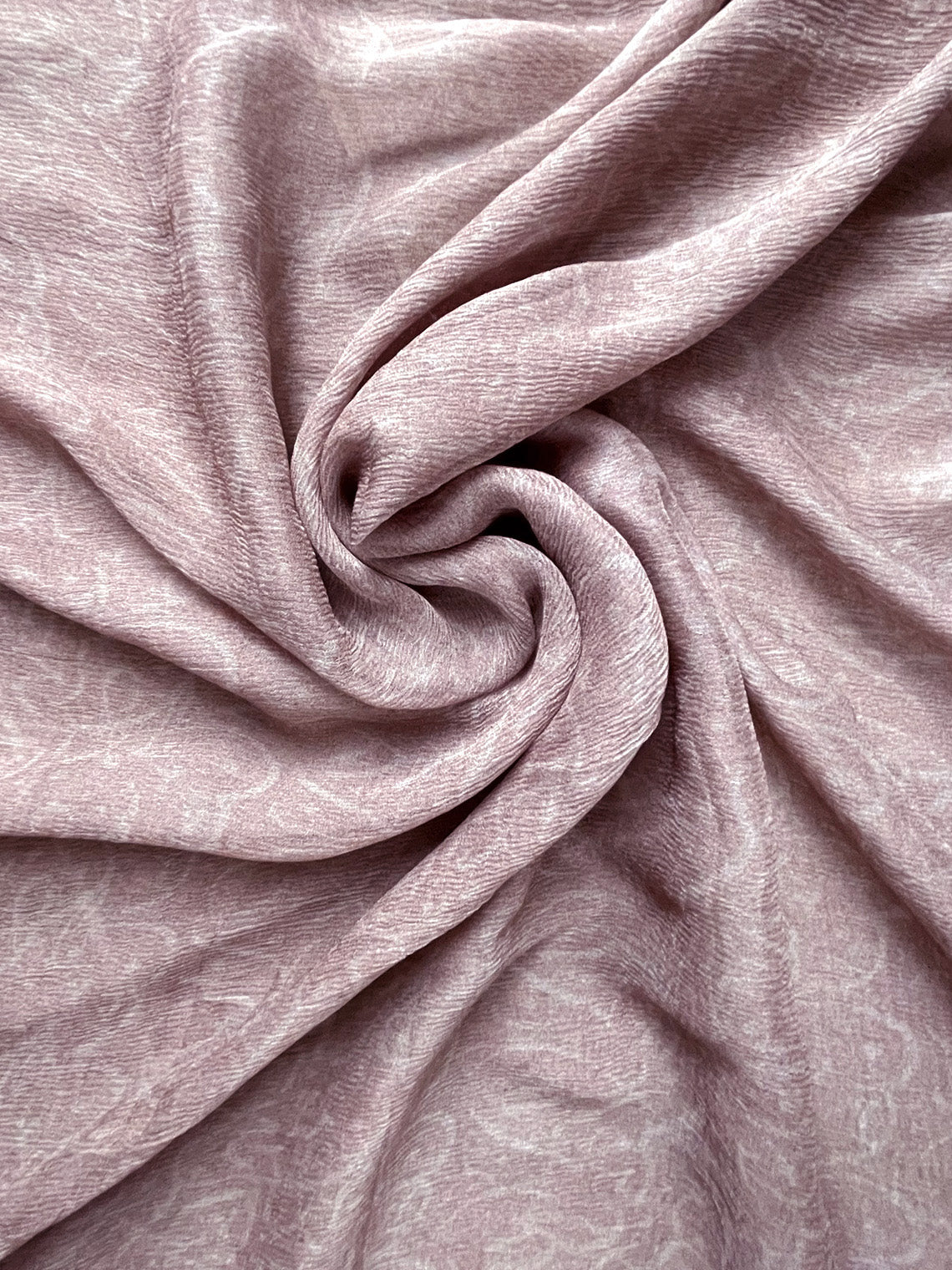 Close-up of pink fabric with folds