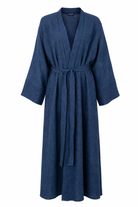 Model wearing the Bahr blue linen jacket over the matching Bahr abaya with a cream hijab