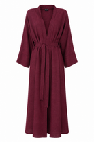 Lightweight linen lycra fabric detail in deep pomegranate maroon