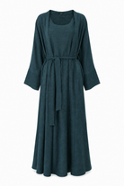 Full length view of the Fayrouz teal abaya showing the straight relaxed cut